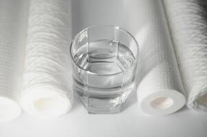 filter cartridges for water on a white background. Installation of reverse osmosis water purification system. photo