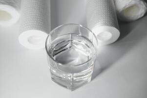 filter cartridges for water on a white background. Installation of reverse osmosis water purification system. photo