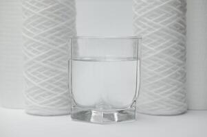 filter cartridges for water on a white background. Installation of reverse osmosis water purification system. photo