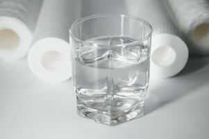 filter cartridges for water on a white background. Installation of reverse osmosis water purification system. photo
