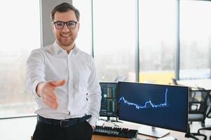Successful trader in formalwear checking cryptocurrency information data on finance market graph, working in office photo