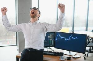 Successful trader in formalwear checking cryptocurrency information data on finance market graph, working in office photo
