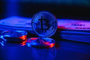 A symbolic coins of bitcoin on banknotes of dollars. Exchange bitcoin cash for a dollar. photo