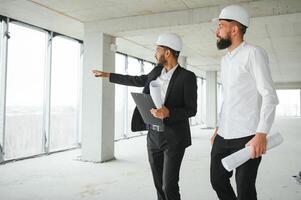 two multiracial business man construction site engineer photo