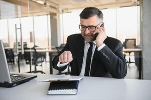Experienced executive manager quarreling with employee on mobile yelling and screaming about bad report and failure with project, mad boss angry about software bugs in application for work photo
