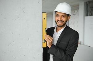 Portrait of a Indian engineer posing at the camera photo
