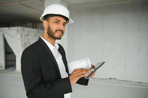 Asian Engineer standing on site construction posting confident , Engineer construction happy job success with in target planning photo