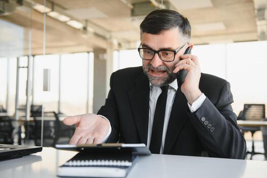 Experienced executive manager quarreling with employee on mobile yelling and screaming about bad report and failure with project, mad boss angry about software bugs in application for work photo