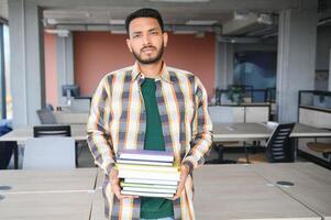 indian student with books at university photo