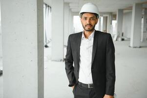 Portrait of a Indian engineer posing at the camera photo
