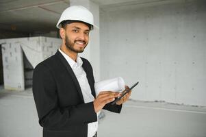 Portrait of a Indian engineer posing at the camera photo