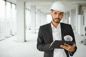 Portrait of a Indian engineer posing at the camera photo