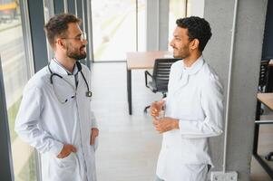 Two young male doctors in the clinic photo