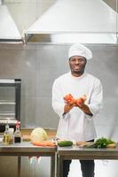 handsome african american chef at restaurant kitchen photo
