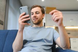 Online payment,Man holding a credit card and using smart phone for online shopping photo