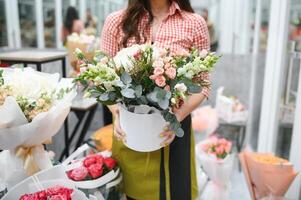 Startup successful sme small business entrepreneur owner woman standing with flowers at florist shop service job. Portrait of caucasian girl successful owner environment friendly concept banner photo