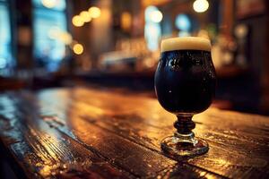 Dark, frothy beer sits on a rustic wooden table in a cozy pub, inviting relaxation in the warm, dim lighting photo