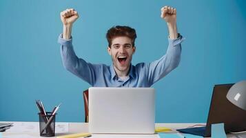 Elated Young Digital Marketing Manager Celebrates Successful Project Completion at Office Workstation photo