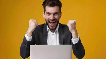 Energetic Marketing Manager Celebrating Business Success with Computer photo