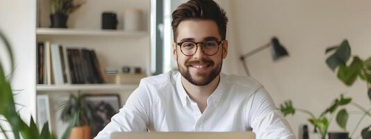 Happy Young Tech Professional Smiling at Computer in Modern Office photo