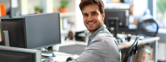 Smiling Young Businessman Working at His Desk in a Bright Office Environment photo