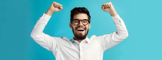 Triumphant Young Professional Celebrating Workplace Success with Raised Arms photo