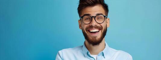 Confident Young Businessman Smiling and Working at Office Desk with Laptop Computer photo