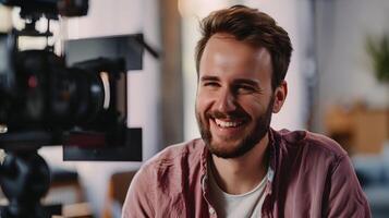Confident Young Film Director Smiling at in Studio Setting photo