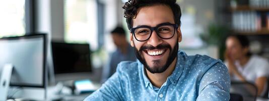 Confident IT Professional Smiling at Work with Computer in Office photo