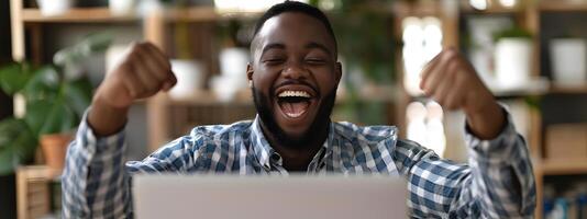 Overjoyed Professional Celebrating Business Milestone on Laptop photo