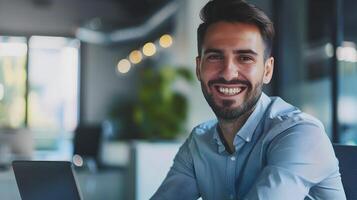 Smiling Young Professional Businessman Working on Laptop in Office photo