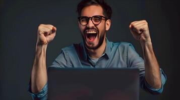Thrilled IT Professional Celebrates Career Milestone at Desk photo
