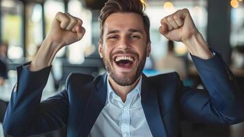 Triumphant Businessman Celebrating Professional Success in Corporate Office photo