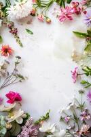 Vibrant collection of spring flowers forming an elegant border on a white backdrop, with space for text. Perfect for invitations, greeting cards, and seasonal promotions photo