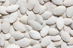 Top view of pumpkin seeds pattern texture background photo