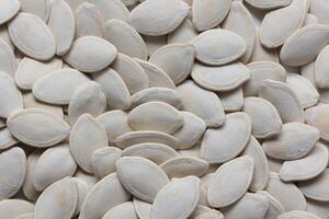 Top view of pumpkin seeds pattern texture background photo