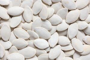 Top view of pumpkin seeds pattern texture background photo