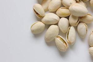 Pistachios nuts seeds on white background photo