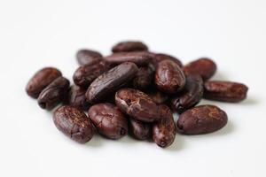 Roasted cocoa beans isolated on white background photo