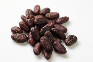 Roasted cocoa beans isolated on white background photo