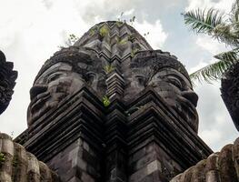 Two Buddha faces composed of andesite rock, the monument was built with the aim of being a tourist attraction as well as a place of worship photo