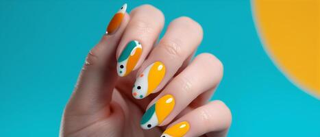 Close-up of a hand with vibrant, colorful nail art on a blue background. Trendy and modern manicure with geometric patterns. photo