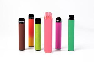 A set of colorful disposable electronic cigarettes of different shapes on a white background. modern smoking. photo