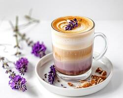 Lavender latte with almond and lavender flowers on white background photo