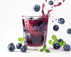 blueberry juice with splash on white background photo