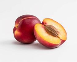 two halves of a peach on a white background photo