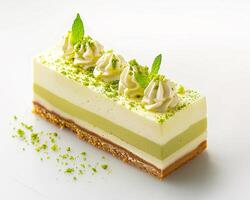 a piece of cake with green and white icing photo