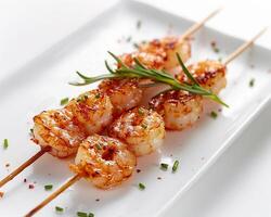 shrimp skewers on a white plate photo