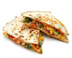 two quesadillas with cheese and vegetables on a white background photo