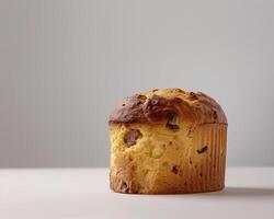a muffin sitting on top of a white table photo